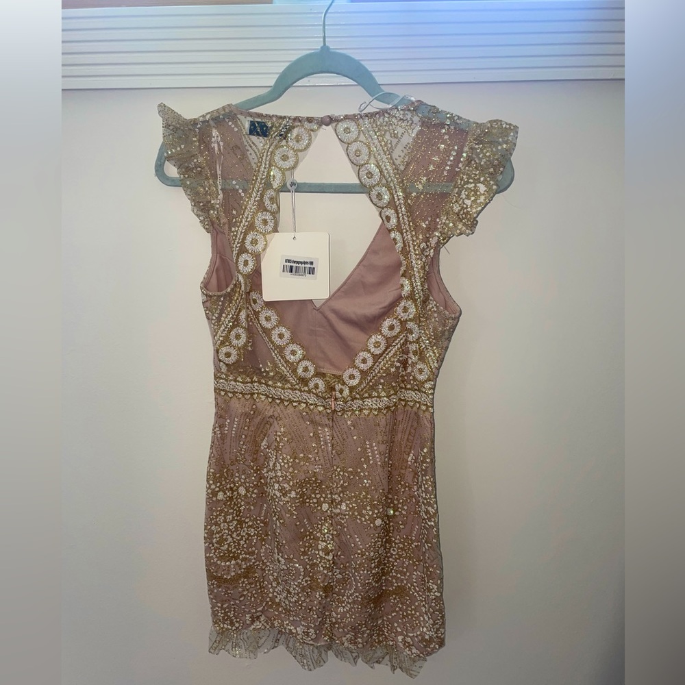 Tan dress with gold detailing from hello molly. Tiny ruffles on the sleeves.